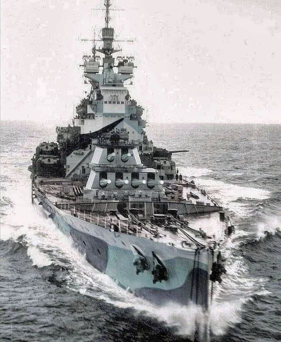 an old photo of a battleship in the water