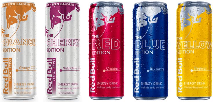 four cans of red bull energy drink are lined up in a row on a white background