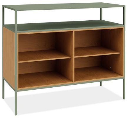 a bookcase with three shelves and one shelf on the bottom is shown in light green