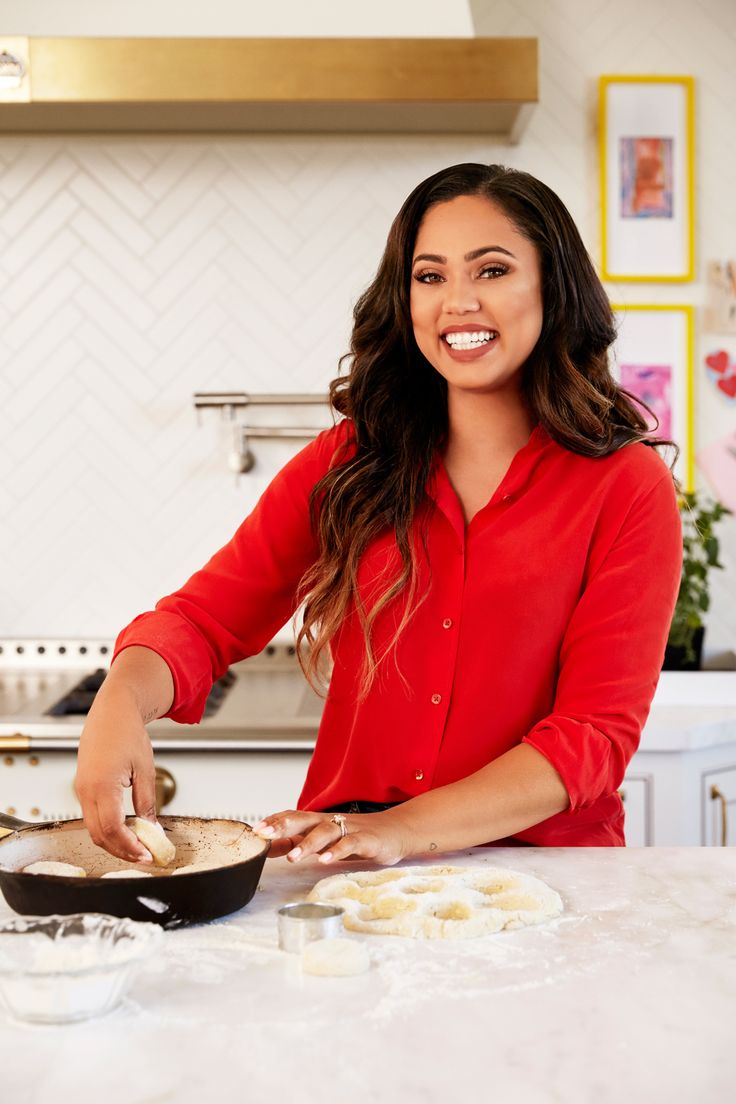 a woman in a red shirt is making food