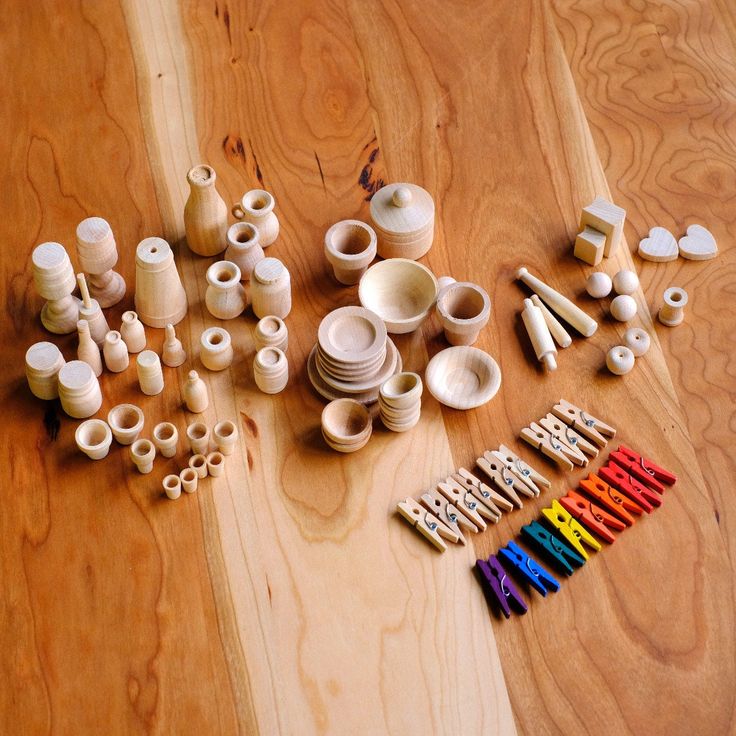 many different types of pottery on a wooden table