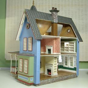 a doll house is shown on a table