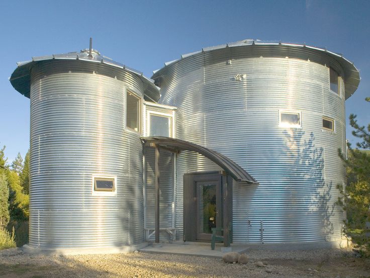 two large metal silos sitting next to each other