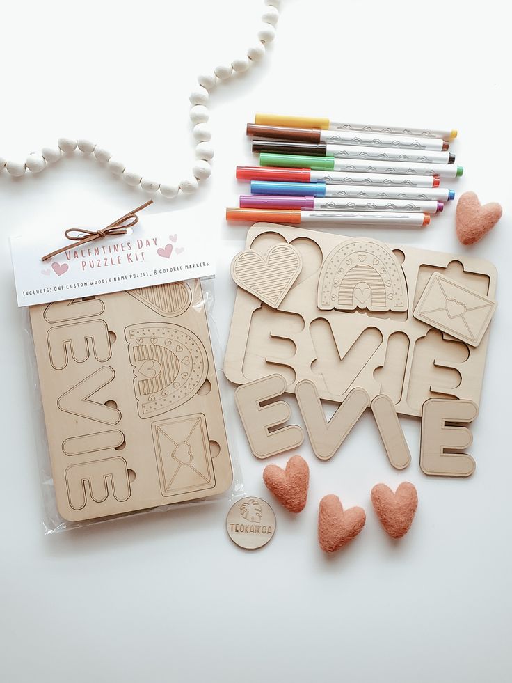 some crafting supplies are laid out on a table with crayons and pencils