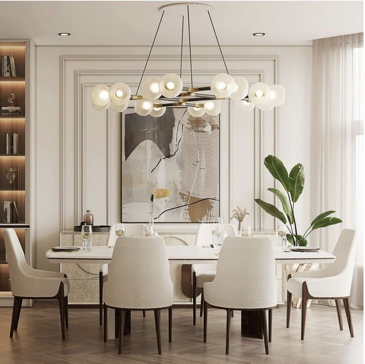 a dining room with white chairs and a table