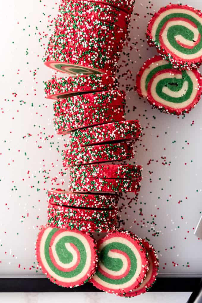 red, green and white candy canes with sprinkles next to each other