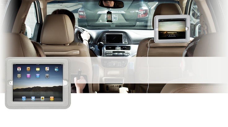 the interior of a car with an ipad attached to it