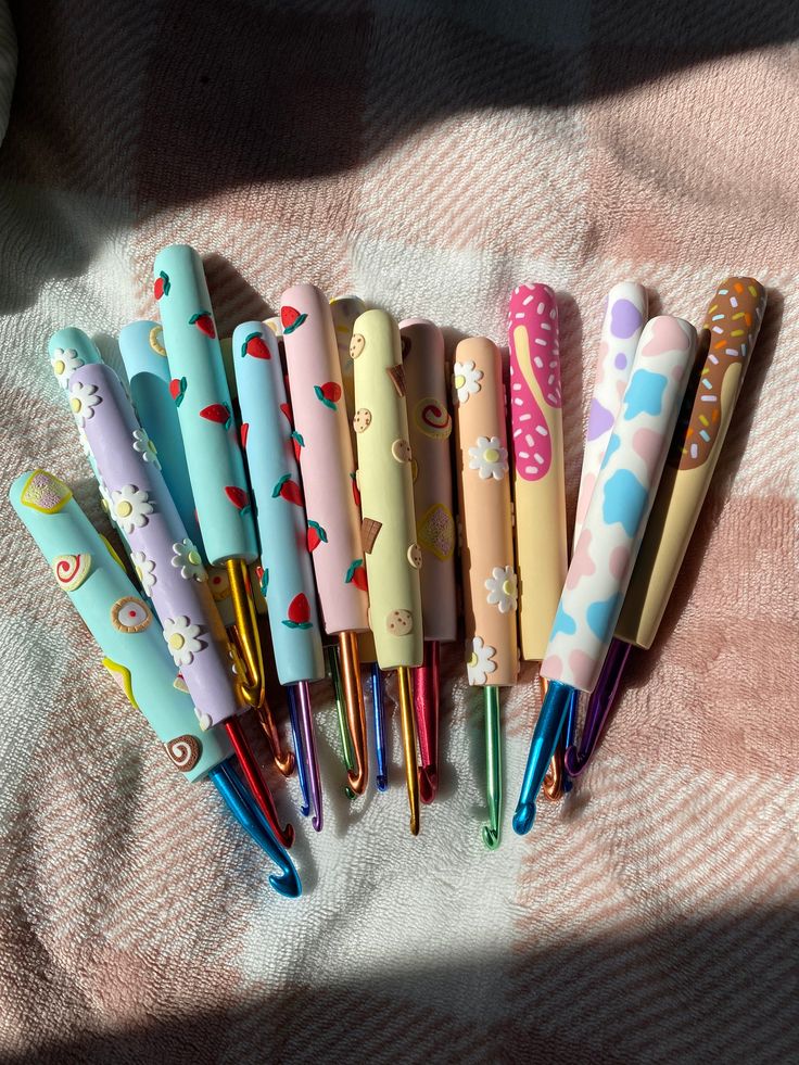 several pens are lined up on a blanket