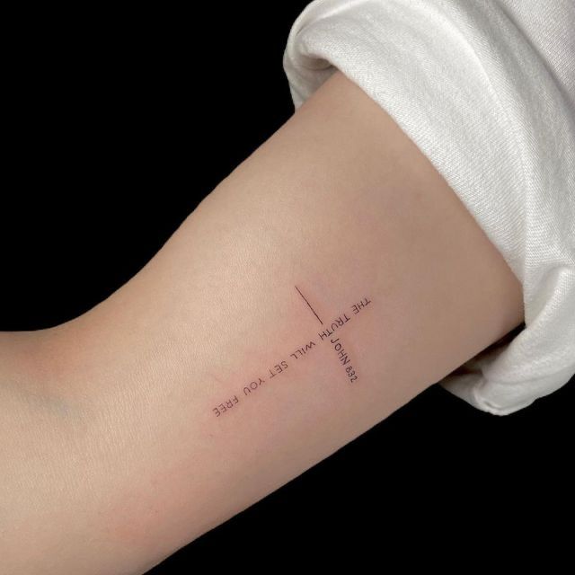 a woman's arm with a cross tattoo that reads, i will always be lost