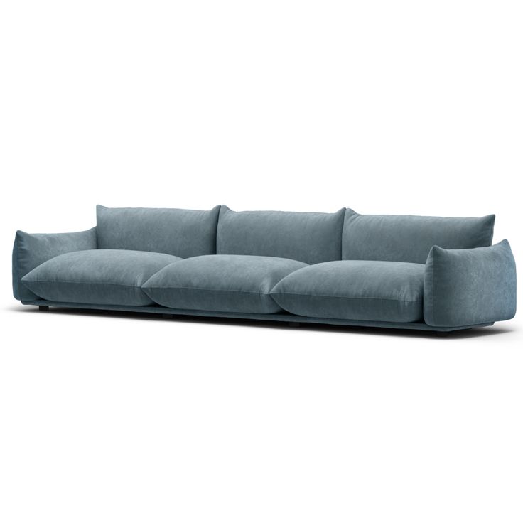 a blue couch with pillows on the back and arms, sitting in front of a white background