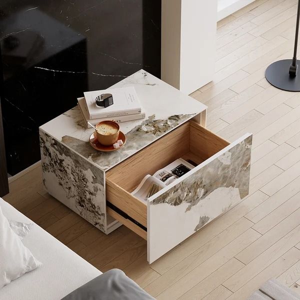 a table with two drawers on top of it in the middle of a living room