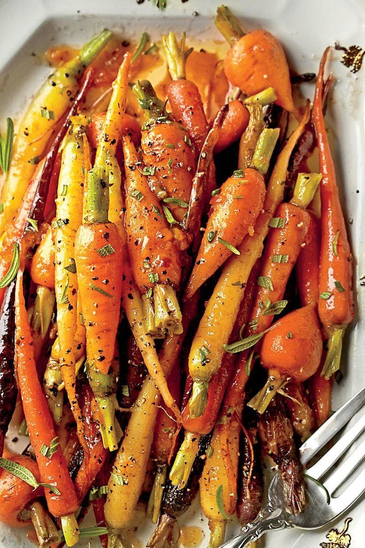 carrots and other vegetables on a white plate