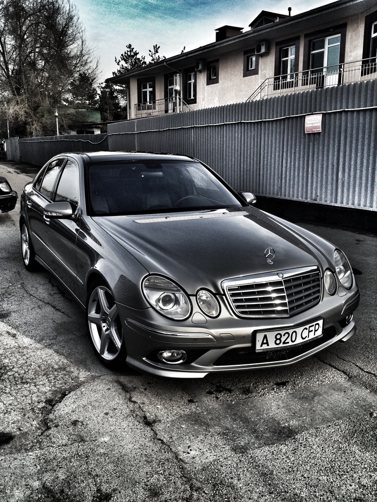 a mercedes benz parked in front of a building