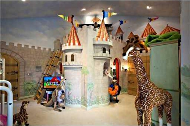 children's playroom with giraffe and castle mural