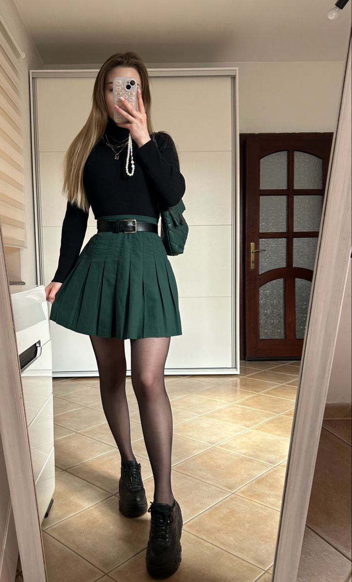 Green Skater Skirt Outfit, Christmas Outfit Green Skirt, Green And Black Skirt Outfits, Green Skirt Black Top, Outfit Ideas With Green Skirt, Dark Green Sweater Vest Outfit, Green Mini Skirt Outfit Fall, Forest Green Skirt Outfit, Emerald Green Aesthetic Outfits