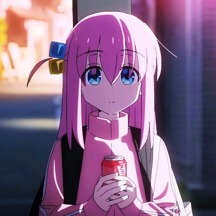 a girl with pink hair holding a can of soda