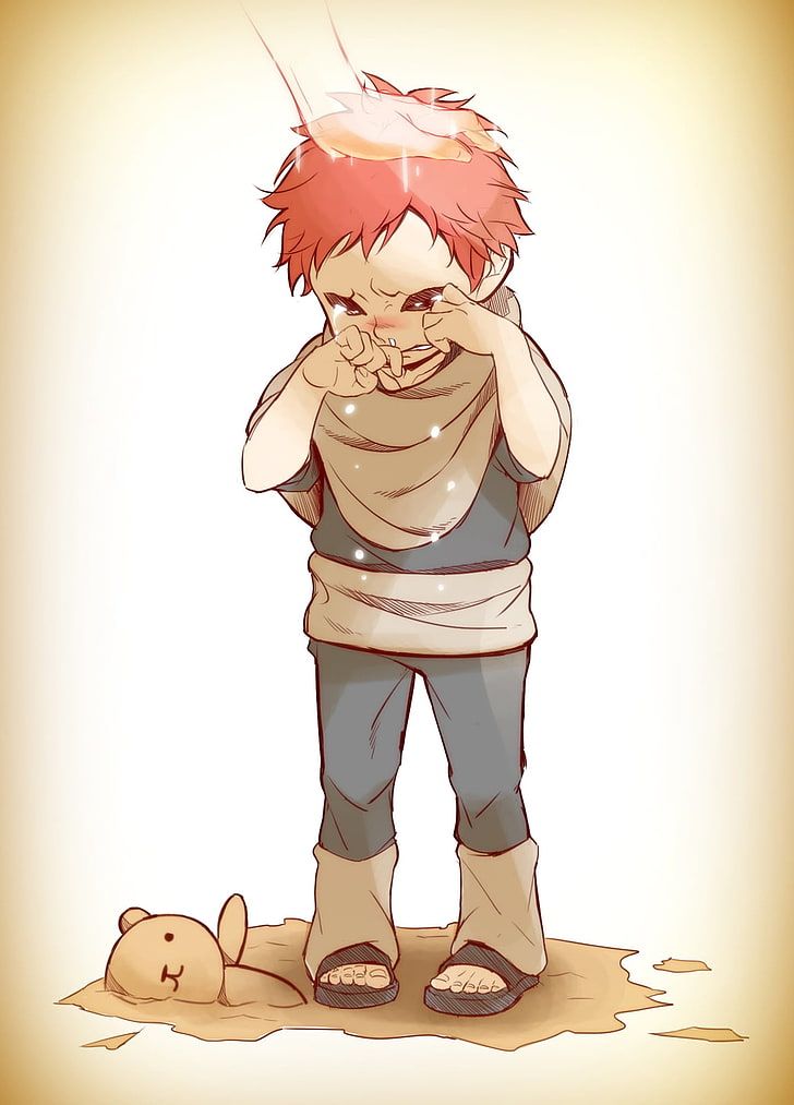 a boy with red hair standing next to a teddy bear and looking at his face