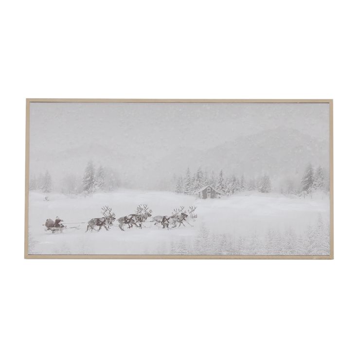 a horse drawn sleigh in the middle of a snow covered field with trees