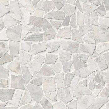 a close up view of a stone wall with white and gray stones on the surface