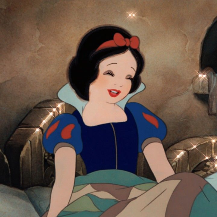 an animated image of snow white sitting on a bed with her hands in her pockets