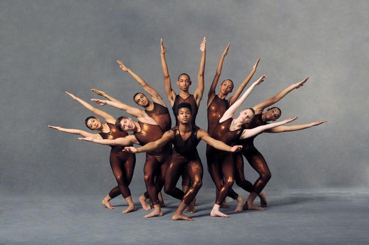 a group of ballet dancers posing for a photo