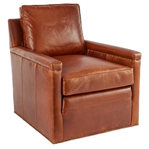 a brown leather recliner chair on a white background