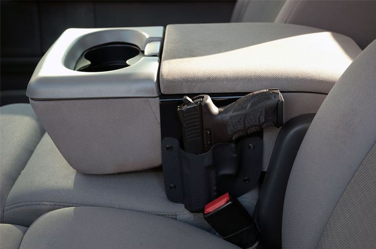 This simple but effective console holster allows you to have your pistol holstered right next to you in the center console of your vehicle for quick deployment. Protection Gear, Truck Ideas, Home Defense, Kydex, Toy Trucks, Truck Accessories, Bang Bang, Repair And Maintenance, Center Console