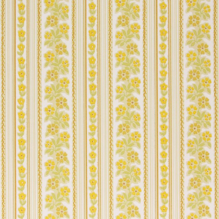 a yellow and white striped wallpaper with flowers on the side, in an ornate pattern