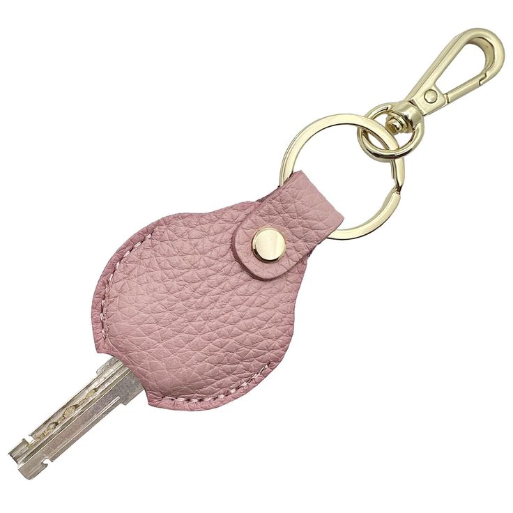 a pink leather key fobring with a gold metal ring on an isolated white background