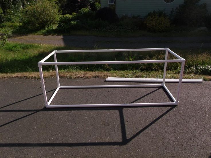 a metal frame sitting on the side of a road