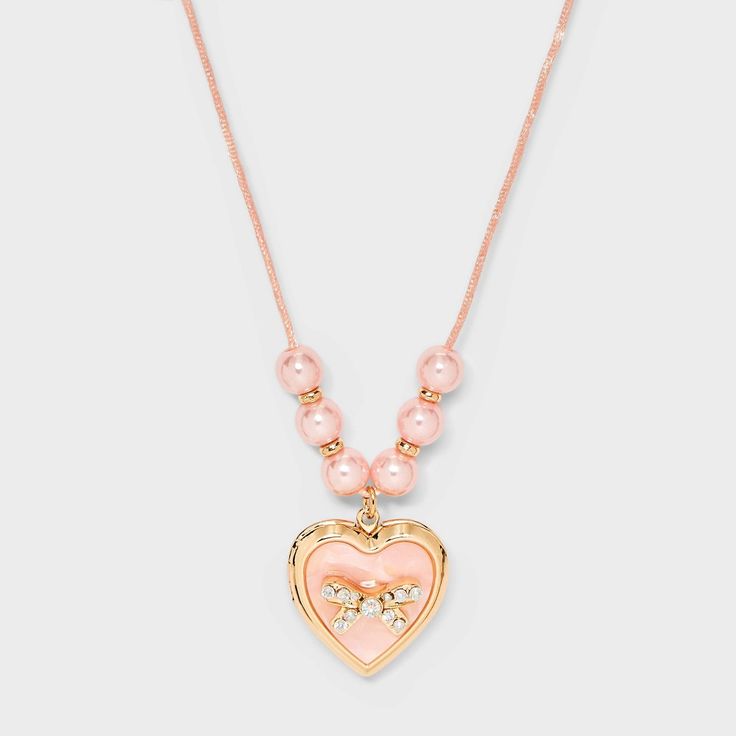 Style your little one with the charming Girls' Pink Bow Locket Necklace from Cat & Jack™ Pink. This cute necklace features a delicate pink bow for added style. Measuring 17 inches in length for a comfy fit, it's delicate and durable design makes it a great accessory for your little one to style with various outfits. Cat & Jack™: Designed for all children so you can trust it's made for yours. Elle Woods Heart Necklace, Heart Necklace For Kids, Preteen Necklace, Pink Adjustable Heart Necklace For Valentine's Day, Pink Adjustable Charm Necklace For Birthday, Playful Pink Necklaces For Mother's Day, Playful Pink Necklace For Mother's Day, Playful Pink Necklace For Valentine's Day, Playful Pink Heart Necklaces