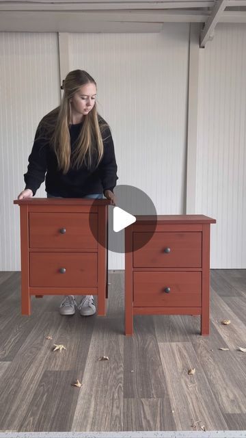 a woman sitting on top of a wooden desk