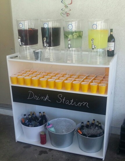 there is a drink station with drinks on it