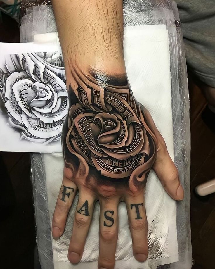 Hand Tattoo For Men 100 Dollar Rose Tattoo Design, Money Rose Hand Tattoo Men, Tattoo Designs Hand Men, Hand Tattoo Cover Up Ideas For Men, Money Rose Hand Tattoo, Hundred Dollar Bill Rose Tattoo, 100 Dollar Bill Rose Tattoo, Money Flower Tattoo, Cover Up Hand Tattoos