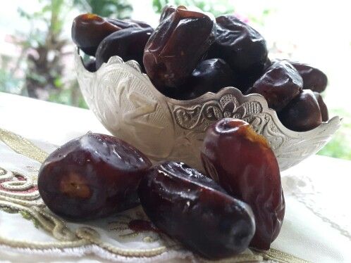 dates are in a bowl on a table