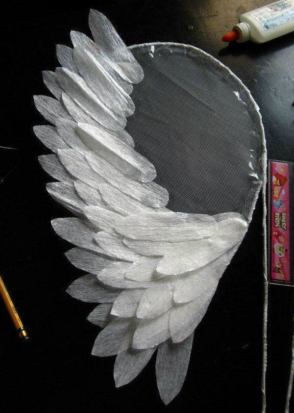 an angel wing is being made out of plastic