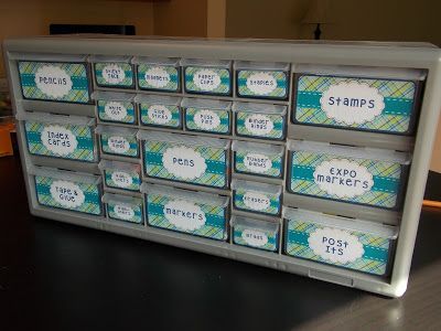 an organized plastic drawer with stamps on the bottom and labels in each drawer that say stamps