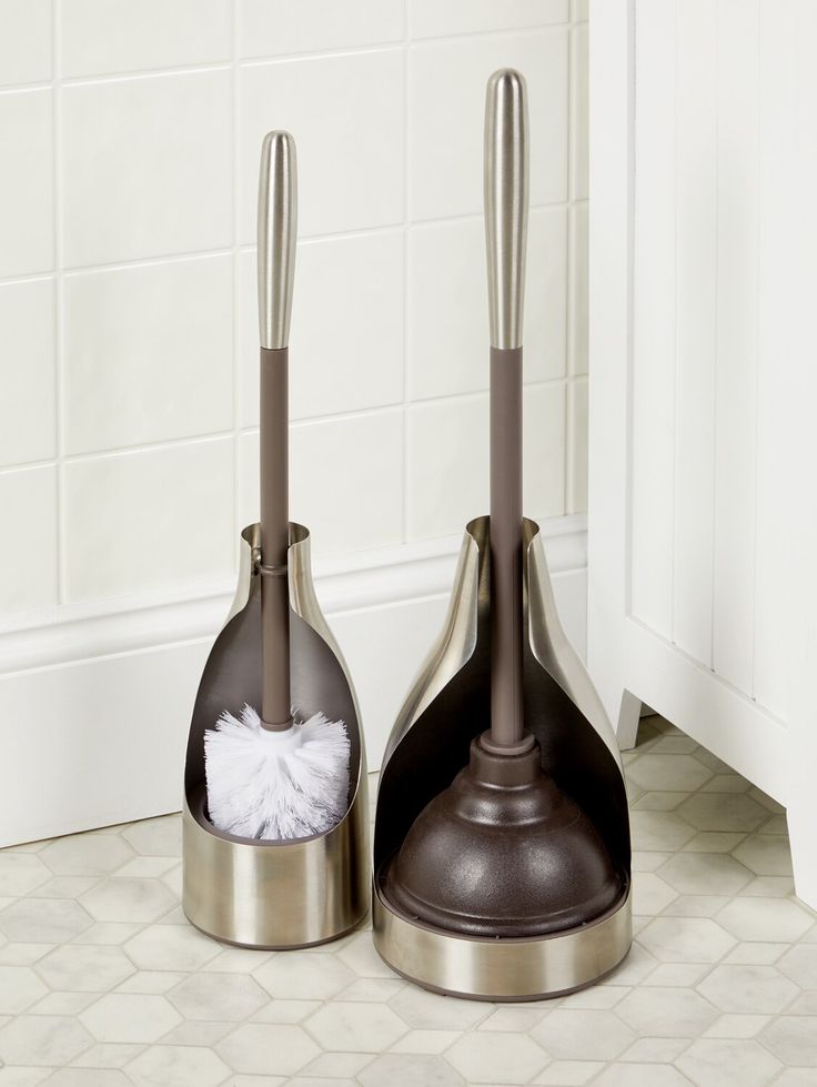 two silver kitchen utensils sitting next to each other