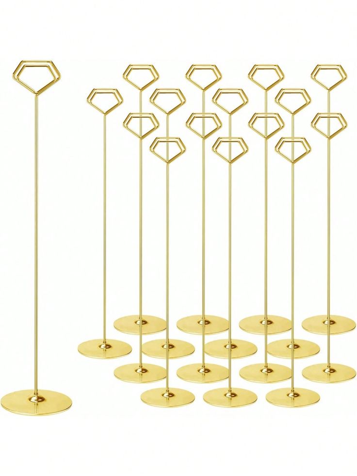 six gold candles are lined up in the shape of hexagons and circles