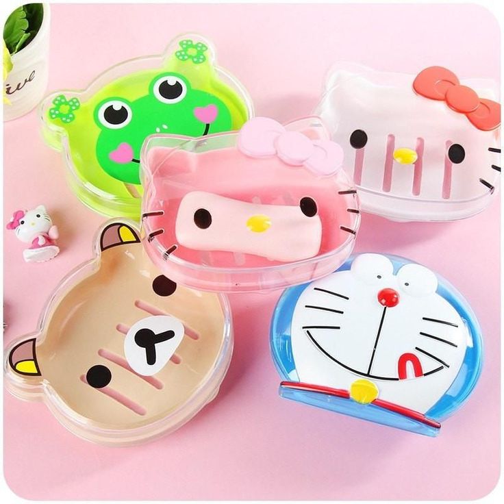 hello kitty plastic plates and trays on a pink surface