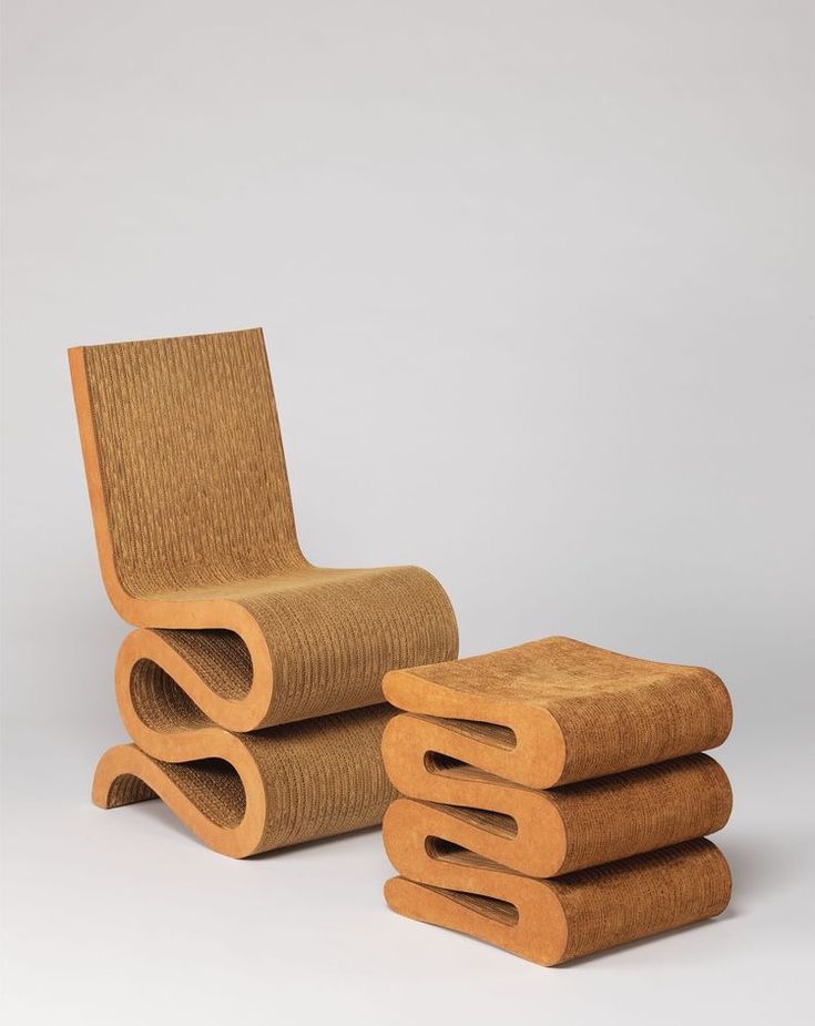 a stack of three wooden chairs sitting next to each other