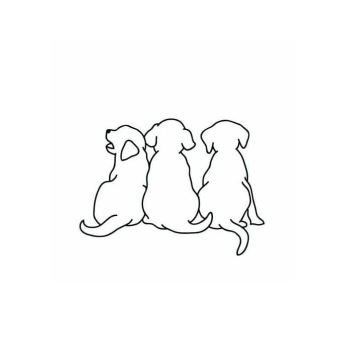 three dogs sitting next to each other