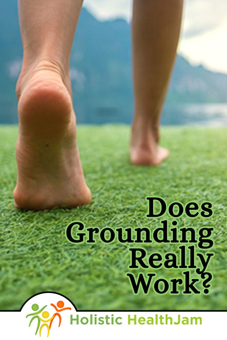 a person walking on grass with the words does grounding really work?