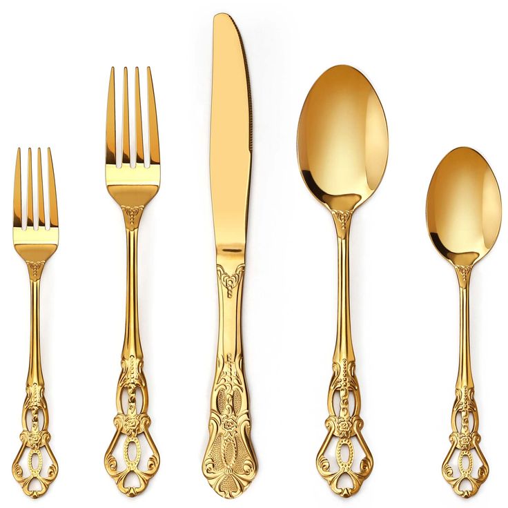 a set of golden utensils and spoons