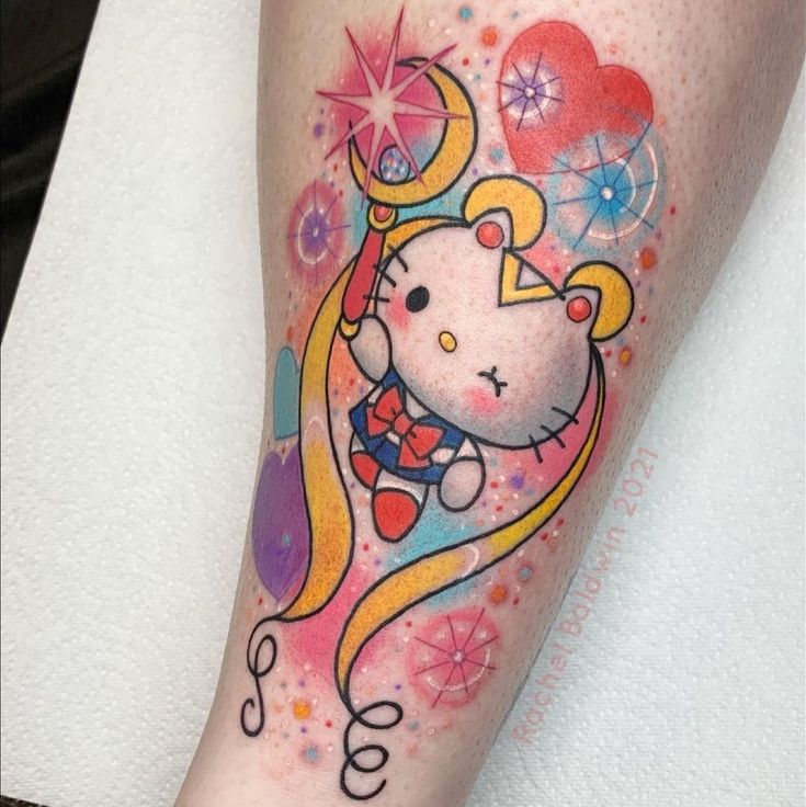 a hello kitty tattoo on the leg of a woman's leg with flowers and hearts