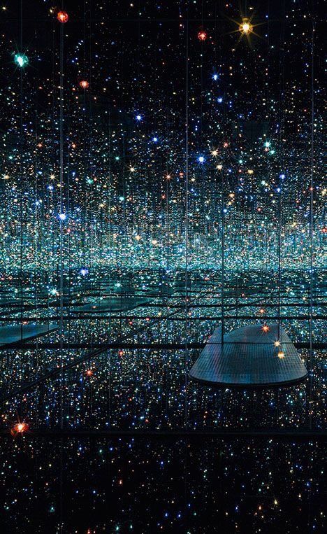 a room filled with lots of lights and stars in the sky, all lit up