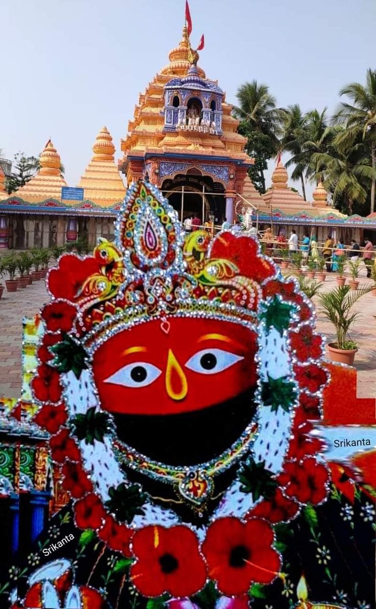 an elaborately decorated statue in front of a temple