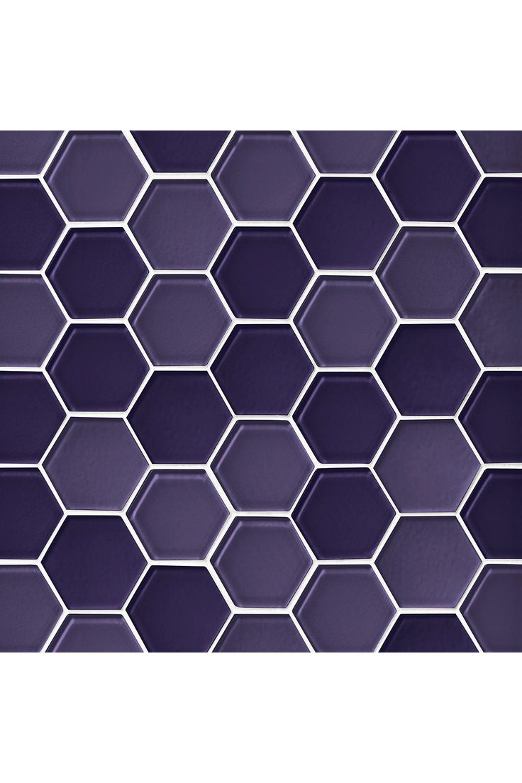 a purple tiled wall with hexagonal tiles