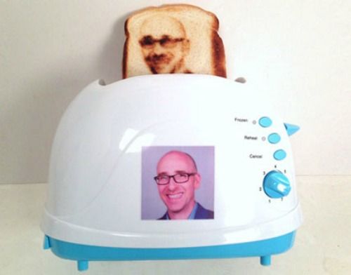 a toaster with a photo of a man's face on the front and side