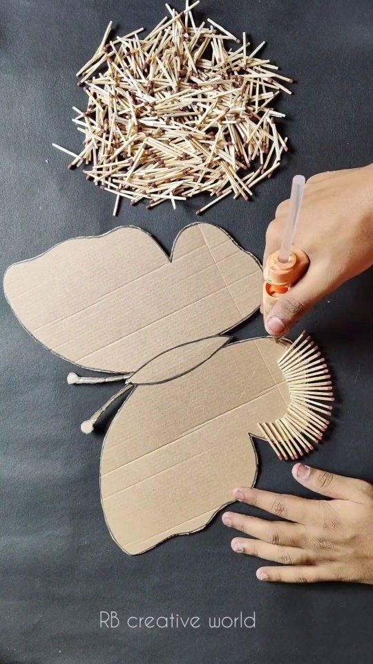 someone is making a paper flower out of cardboard